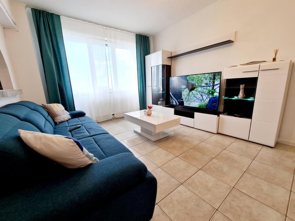 Central Apartment with Blue Sofa